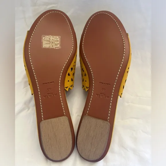 Alaïa Leather slip ons laser cut vienne cut outs. NWT. Mustard color.