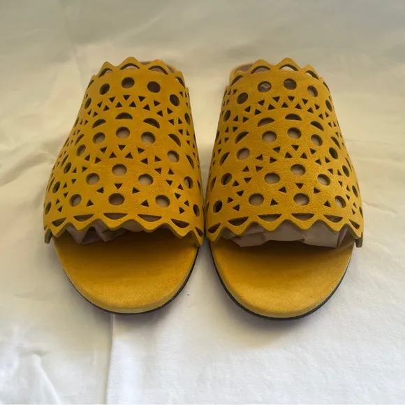 Alaïa Leather slip ons laser cut vienne cut outs. NWT. Mustard color.