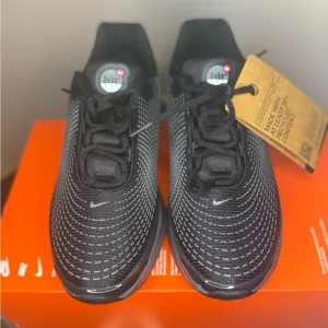 Nike Black and White Athletic Shoes with 3D Textured Design