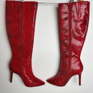 Red snake print knee high boots