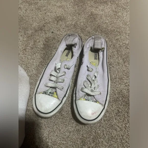 Well worn and well loved womens light purple converse shoes