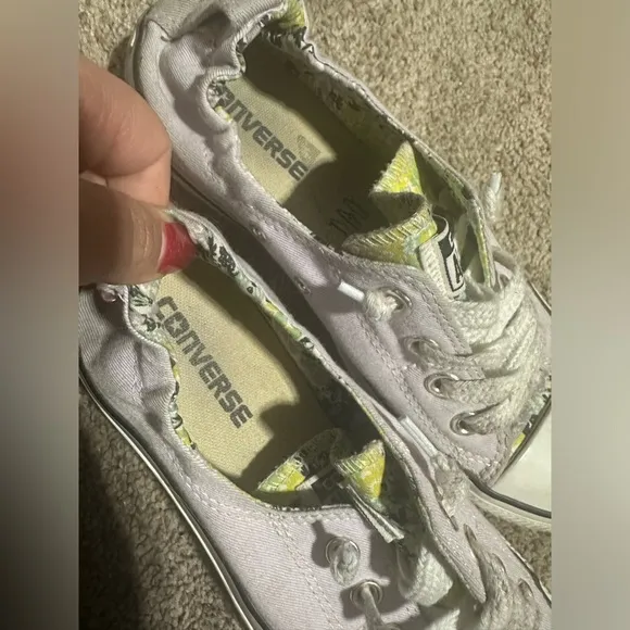 Well worn and well loved womens light purple converse shoes