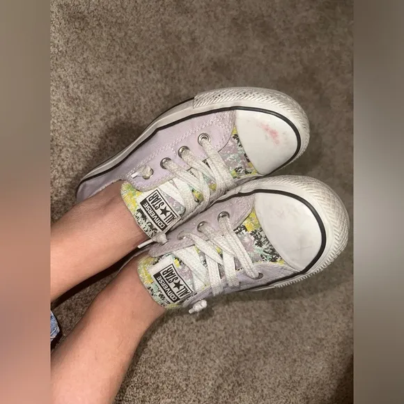 Well worn and well loved womens light purple converse shoes