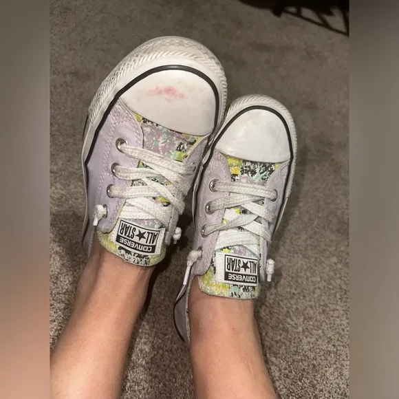 Well worn and well loved womens light purple converse shoes