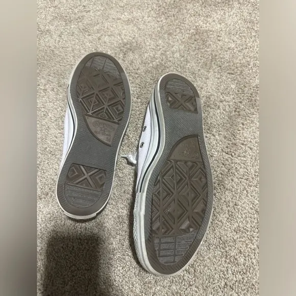 Well worn and well loved womens light purple converse shoes