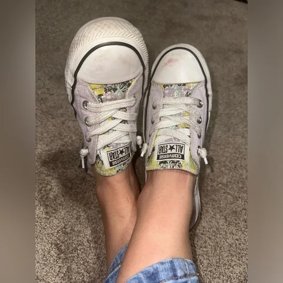 Well worn and well loved womens light purple converse shoes