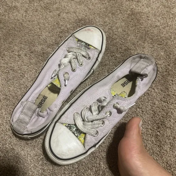 Well worn and well loved womens light purple converse shoes